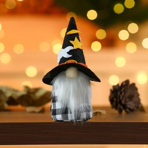 Close-up of Halloween gnome doll with black wizard hat and festive starry patterns