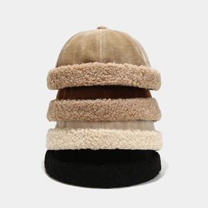 Vertical stack of brimless caps in corduroy and fleece textures with four color options