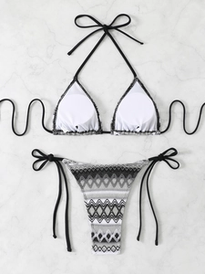 Detailed flat lay of ethnic geometric print bikini bottoms with adjustable side ties