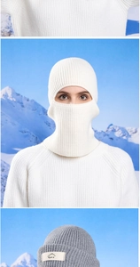 Detailed knit texture of white winter balaclava and gray sport beanie for cold protection