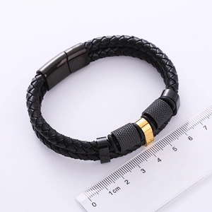 Detail of double-layer woven leather bracelet for men with steel clasp and ruler reference