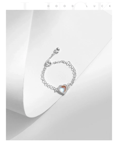 Detailed view of heart-shaped moonstone and adjustable S925 sterling silver chain ring