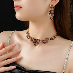 Vintage jewelry set with burgundy crystal square leaf necklace and matching earrings