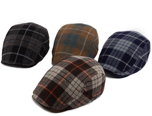 Detailed flat lay of wool blend plaid newsboy caps in four classic autumn colors