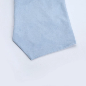Macro detail of soft light blue suede fabric texture and hem stitching on summer set