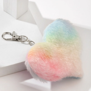 Close-up of a rainbow plush heart keychain with glitter and silver metal lobster clasp