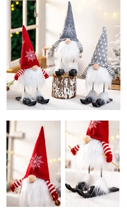 Detail view of plush Christmas gnomes with ski poles and cozy knitted hats in snow scene