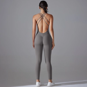 Deep grey yoga jumpsuit featuring backless cross straps and scrunch butt lifting details