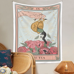 Detail of tarot style tapestry featuring hand pouring tea illustration on a cozy wall