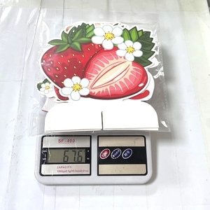Weight measurement of 67.6g for strawberry themed paper cake toppers and party favors