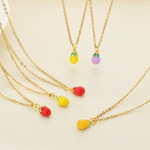 Detailed view of colorful enamel vegetable charms on thin gold stainless steel chains