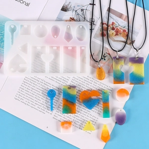 Detail of geometric silicone molds for resin crafts with colorful gradient heart pendants