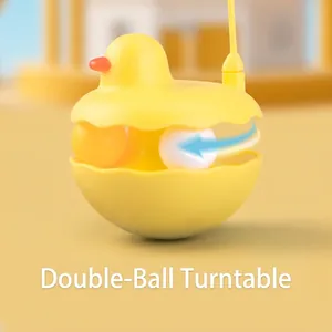 Tumbler cat toy with duck design featuring dual-track rolling balls and feather wand stick