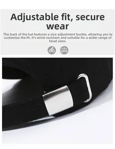 Detail view of the silver metal adjustable buckle on the black wool baseball cap