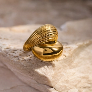 Detail of 18k gold plated stainless steel ring with smooth and textured finish