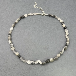 Detail of natural irregular gemstone beads necklace with stainless steel lobster clasp