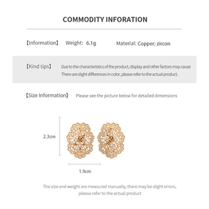 Detailed view of hollow gold oval earrings with copper zircons and product dimensions