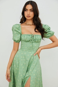 Detail of green floral puff sleeve dress with square neck and adjustable drawstring bust