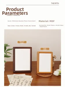 Detailed view of walnut and teak finish wooden photo frames on a minimalist desktop