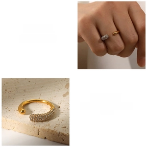 Close-up of teardrop ring with pave-set crystals and gold plating on stone