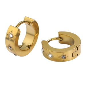 Golden titanium steel hoop earrings featuring engraved starburst and inset rhinestones