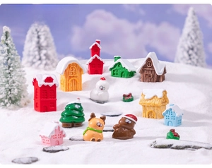 Detailed view of mini Christmas resin figurines with snow effect for DIY micro landscapes