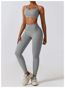 Detail of high-waist yoga set with grey sports bra and compression leggings