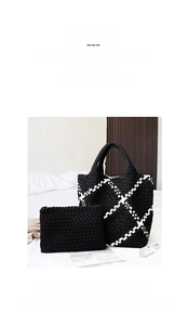 Detail of black and white woven tote bag set with matching small inner pouch