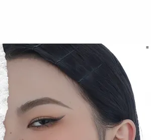 Minimalist matte black metal hairpins shown on side hair with sleek parallel arrangement