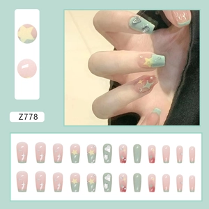 Short ballet press-on nails set in mint green and pink with stars and heart rhinestones
