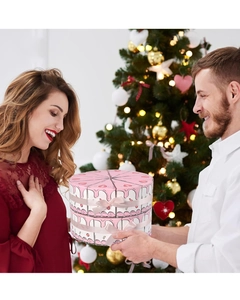 Creative pink triangle cake gift box with ribbon shown in festive gifting scene