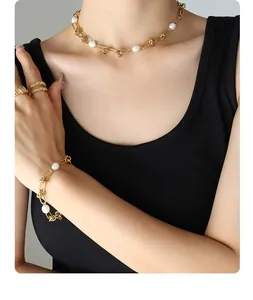 French vintage style gold plated jewelry set featuring pearl necklace and knotted chain