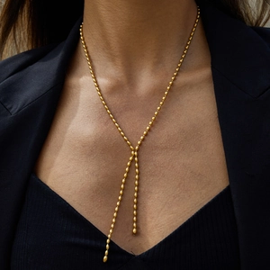 Classic 18K gold-plated stainless steel Y-shaped necklace with bead tassel worn by model