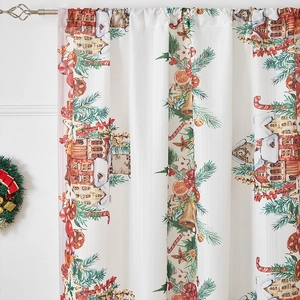 Detailed close-up of Christmas curtains with gingerbread, golden bells, and candy cane prints