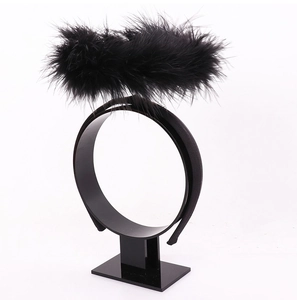 Detail of black faux feather halo headband for angel or dark angel costumes
