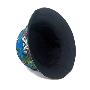 Reversible bucket hat featuring colorful tiger print and minimalist solid black side