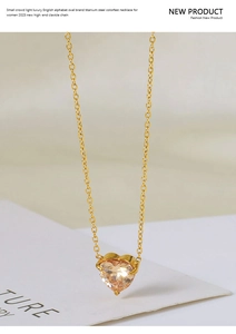 Macro shot of titanium steel heart pendant with champagne zircon and 18k gold plating