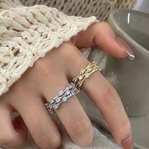 Three-layer zircon interlaced rings in gold and silver finish for a luxury layered look