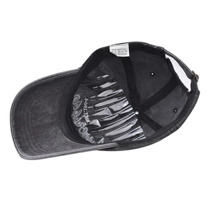 Detail view of 100% cotton washed grey baseball cap with adjustable metal buckle strap