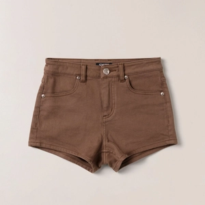 Classic high-waisted brown denim shorts in A-line cut with utility pockets and metal button