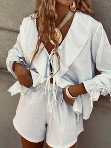 Women's light blue cotton set featuring a ruffled lace-up shirt and high waist shorts