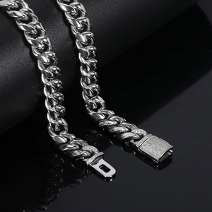 Detailed macro view of 12mm silver Cuban link chain with luxury diamond-set box clasp