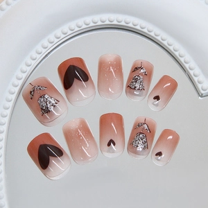 Brown ombre press-on nails with silver glitter floral and black heart designs