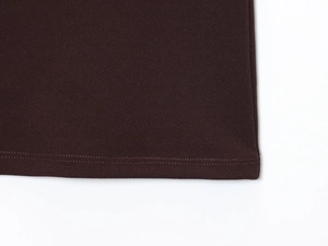 Detailed view of the double-needle flat stitch hem on this dark brown vest top