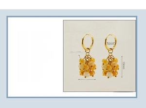 Detail view of 18K gold plated stainless steel hoop earrings with natural stone beads