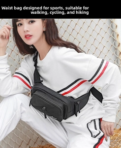 Detail of black waterproof nylon waist bag with multiple zippers and adjustable buckle strap