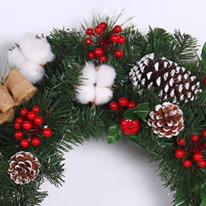 Linen and cotton Christmas wreath with red berries, pine cones and white cotton balls