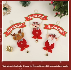 Detailed view of Christmas ornaments with Santa, snowman and deer with gold bells