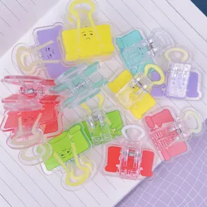 Clip per raccoglitori in acrilico colorato macaron con graziosi motivi emoji su taccuino
