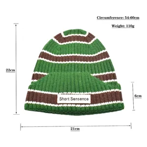 Three-color striped knit beanie in green, brown and white with size and weight details